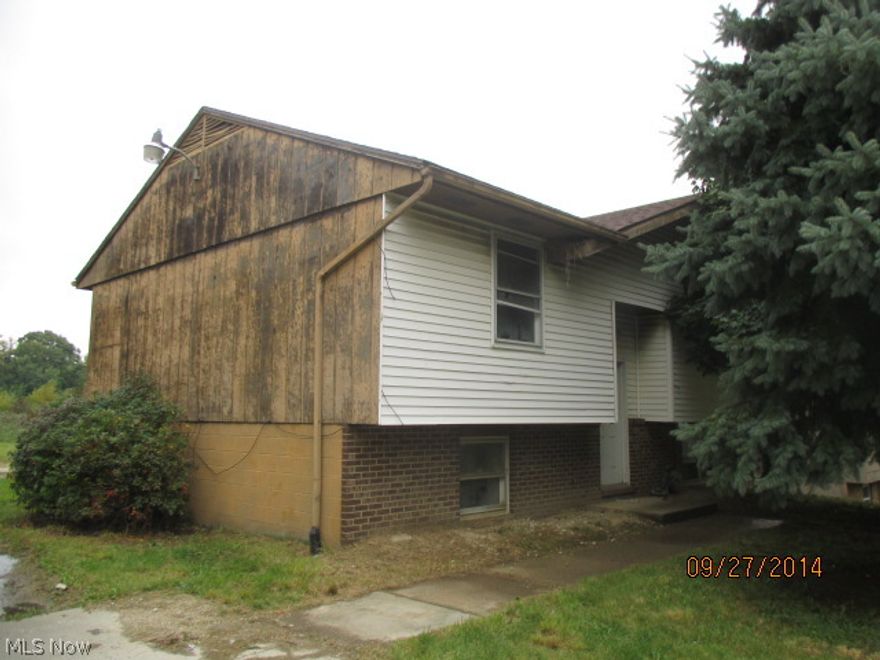 Unique bi-level home in east Akron! Features include 4 bedrooms, 2 full baths in 1354 sq.ft. of living space. Foyer entry splits two levels. Upstairs is living room and open kitchen. Plenty of light oak cabinets and counter space. Dining area has sliding glass doors out to custom wood deck. Ideal for entertaining in warmer months! Two bedrooms upstairs with 1 full bath. Downstairs are two more bedrooms and another full bath. Utility and laundry room. Convenient to shops, schools and public transportation. All offers must be submitted with pre-approval letter or proof of funds.