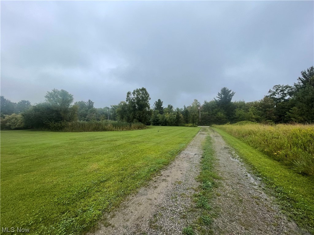 LOCATION LOCATION LOCATION !!! 10 ACRES on paved road with pond, outbuilding, well, septic and driveway !! This 10 acres was previously used as a residence but old manufactured home needs removed by new buyer and build your dream home on this beautiful 10 acres ... open in the front with pond and wooded in the back !! 20 x 40 building has electric and cement floor. Call today to start making your dream come true of building your own home on this great piece of property !!