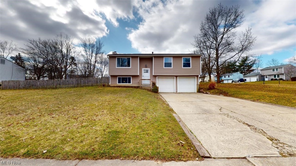 Welcome home to meticulously maintained 3 bedroom bi-level home. You will love the open floor plan on the main floor with beautiful laminate flooring. The lower level has been remodeled with stunning LVT flooring, fresh paint throughout and also boasts a half bath & woodburning stove. Right outside of the slider doors in the kitchen, you will find the fully fenced in backyard. You will spend your summer enjoying the oversized lot with maintenance free deck and patio area. Schedule your private showing NOW, this one won't last!