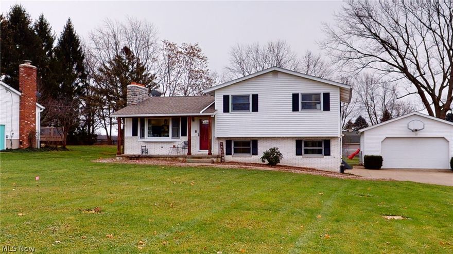 Wow!! This is not your typical split! Gorgeous and inviting 4BR/2B home on a picturesque lot overlooking a well maintained yard. Stunning custom built maple kitchen with granite, opens to a spacious, fireplaced living room with bay window... Beautiful Sunroom addition leading to large deck. Finished Lower Level with family room & office area. Remodeled Baths feature jetted tub/tiled surround & granite countertops. Large 24' x 32' Garage built in 1998--Call today for a private showing--you'll be glad you did!