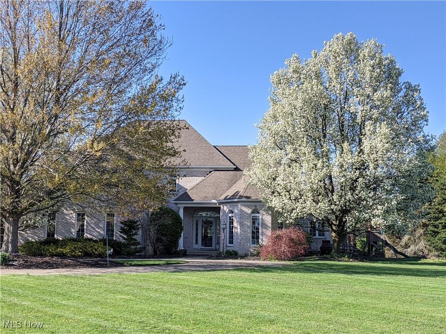 This beautifully renovated 4-bedroom home sits on a generous 1-acre lot, offering a perfect blend of comfort, style, and functionality. The spacious open-concept kitchen features abundant cabinetry and a massive island with seating, flowing seamlessly into a cozy living room anchored by a striking stone fireplace and space for a large-screen TV. The first-floor primary suite includes a luxurious ensuite bath and walk-in closet, while the main level also boasts a formal dining room and a dedicated office with custom built-ins. Upstairs, you'll find a private bedroom suite with its own bathroom, plus two additional bedrooms connected by a Jack-and-Jill bath. The finished basement expands your living space with a game and rec room, a full home gym, a versatile craft room, and ample storage. Outside, enjoy a spacious backyard with a large deck and room for an above-ground pool, along with a detached 1.5-car garage/outbuilding for all your tools and equipment. Recent upgrades include a whole-house generator (2017) and a brand-new roof (June 2025). The hot tub and trampoline are negotiable, adding even more flexibility to this move-in-ready home designed for modern living.