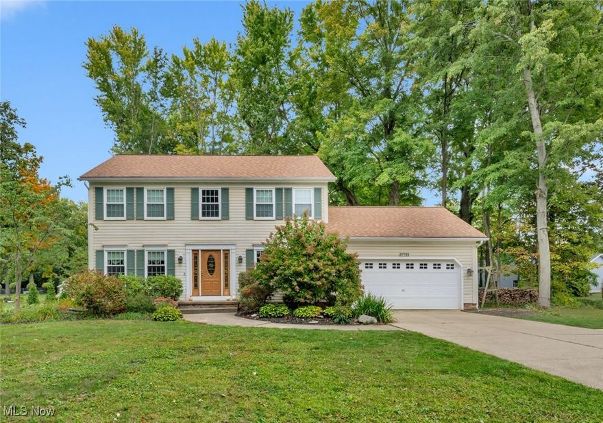 Welcome home to this beautifully updated colonial in the highly sought-after Holly Hills subdivision of Mentor! Perfectly situated on a peaceful half-acre wooded lot in a quiet cul-de-sac, this 4-bedroom, 2.5-bath gem combines timeless style with modern comfort. Step inside to a bright two-story foyer that opens to a stunning updated chef's kitchen featuring a professional-grade stove, beautiful cabinetry, granite countertops, a center island with an abundance of prep space, and sunny eat-in area—perfect for family breakfasts or entertaining friends. The spacious family room, highlighted by a cozy gas fireplace, invites you to unwind after a long day, while the adjoining living room offers even more space for relaxing or hosting gatherings. Host special occasions in the elegant formal dining room, ideal for holiday meals and dinner parties. A convenient first-floor laundry room and attached garage make everyday living easy. Upstairs, retreat to your serene primary suite with a large private bath and walk-in closet. Three additional bedrooms and a full bath provide plenty of room for family or guests. The finished lower level offers flexible living space—ideal for a home theater, game room, or home office. Step outside to your own private backyard oasis, complete with a large deck and hot tub surrounded by mature trees—an inviting space to relax, entertain, or simply enjoy nature. This exceptional home has it all—space, privacy, and modern updates—all in one of Mentor’s most desirable neighborhoods. Don’t wait—schedule your private showing today and fall in love with everything Holly Hills has to offer!