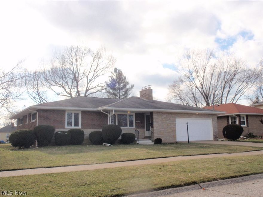 Brick and stone ranch in University Heights.  Nice and clean. Spacious living room has woodburning fireplace and built in bookshelves.  Formal dining area with sliding door to rear covered patio. Pocket door separates the dining room and kitchen w/its abundance of cupbaords and  pantry.  2nd dining area at the far end of the kitchen overlooks the backyard.   Basement is partially finished and has 2nd fireplace,  wet bar, and berber carpet.  Home has had some upgrades including electrical, central air unit 2012, basement waterproofing system by Daniels ('02 & '04), glass block windows, and Anderson vinyl replacement windows in 2008. This is a solid home , but will need cosmetic improvements - being SOLD 'AS IS" and seller will not make any repairs.   Homestead reduction has already been added to tax figure. Light fixture in kitchen dining area does not stay and will be replaced. Corner hutch in kitchen is not attached and does not stay. Blt in oven, dishwasher and disposal are not funct