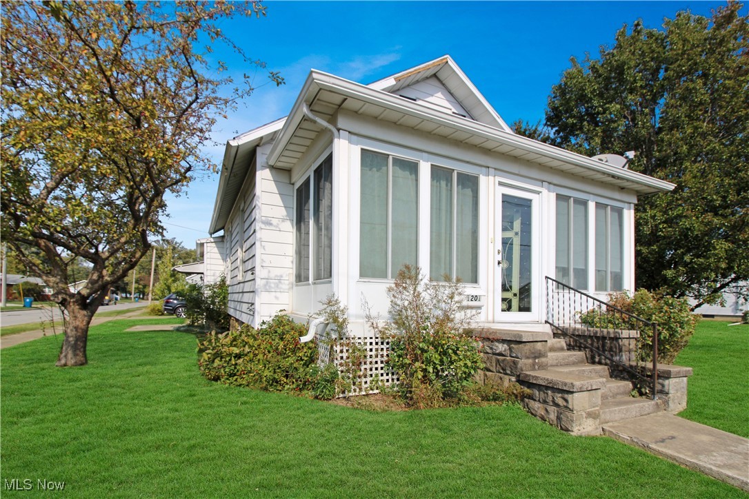 Two-bedroom, 1 1/2 bathroom home near Lakeview Park, City Beach, and so much more! This home has a large eat-in kitchen and a large living room. Spacious enclosed front porch and an extra lot! Being sold as a package.