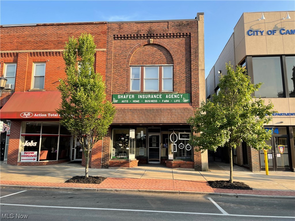 This is not your average downtown building. This one has been maintained throughout the years. Fully re-wired in 1973, new rubber roof in 2000, new HVAC in 2014, new tankless hot water heater 2019. This building is right next to the Cambridge Police station and City administration offices. Presently used as a professional office, insurance agency. At its entrance is a comfortable-sized reception area and general office space. Just beyond it, along a generously wide hallway, are 3 additional individual office spaces. A breakroom and private half bath complete the first floor. Upstairs, with its own separate outside entrance, is a one-bedroom, 1 bath apartment. It needs some work to be rentable. An area beyond the apartment is currently used for storage but is large enough to be converted to another apartment. Minimal work to continue to operate as a professional office required. Large enough to offer multiple possibilities. If you think a location with great visibility help will your b