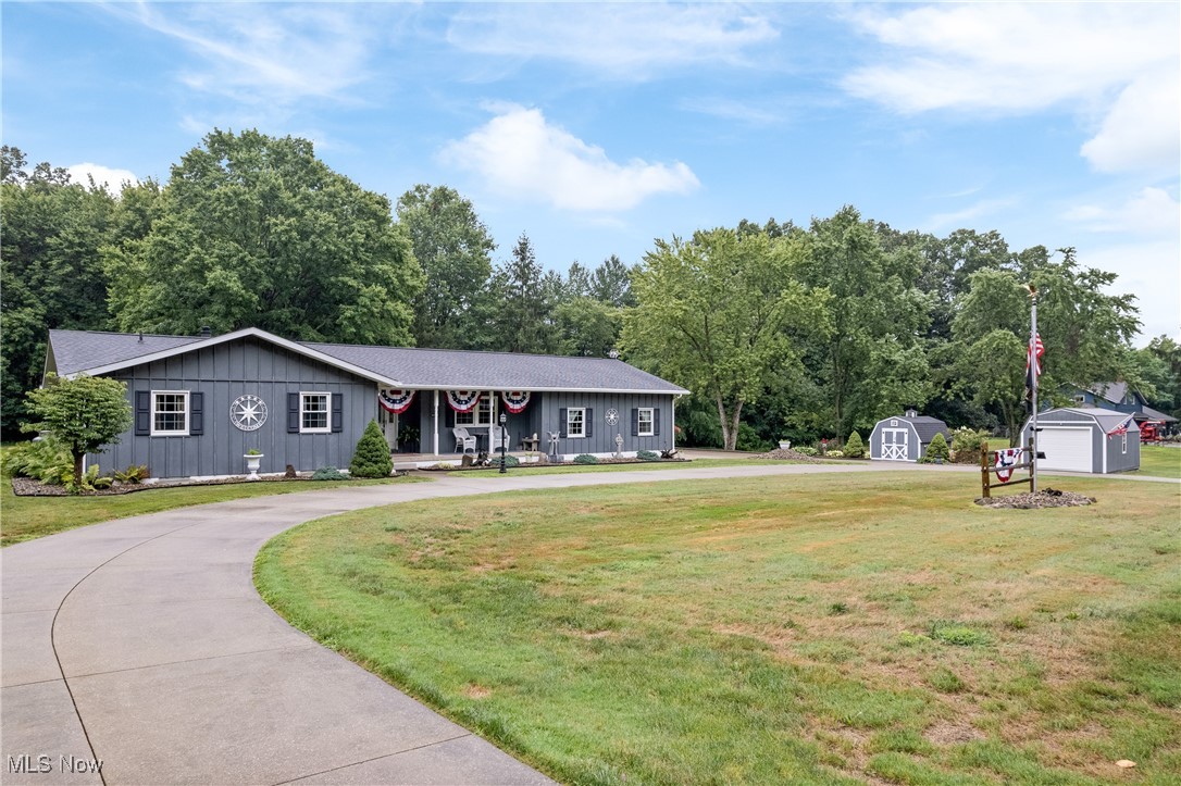 Welcome to your private retreat in Kent, located in the desirable Field School District! Nestled on 2.15 scenic acres, this spacious ranch home offers the perfect blend of comfort, updates, and functionality—all just minutes from restaurants, shopping, and major highways for an easy commute and everyday convenience. The main level features 3 bedrooms and 2.5 bathrooms, including a primary suite with dual closets and a beautifully updated ensuite. You’ll love the renovated kitchen, cozy living room with fireplace, and a sunroom with panoramic views of the wooded backyard—perfect for year-round enjoyment with a portable A/C unit and wall heater. The dining room and additional updated full bath complete the main floor. Downstairs, the walk-up basement expands your living space with 2 additional bedrooms, a spacious rec room, a laundry area, and plenty of storage. Outside, you'll find a 3-car attached garage, three storage sheds, and a wrap-around driveway with ample space for guests, extra vehicles, or RV parking. Enjoy the peaceful surroundings from the metal-roofed lean-to—a great spot for morning coffee or evening relaxation. Recent updates include: carpet and LVP flooring, newer main roof, metal roof over sunroom, tinted windows, a finished rec room in the basement and half bathroom off the garage. This move-in ready, meticulously kept home has it all—space, privacy, and a prime location close to everything-shopping, restaurants and major highways.
