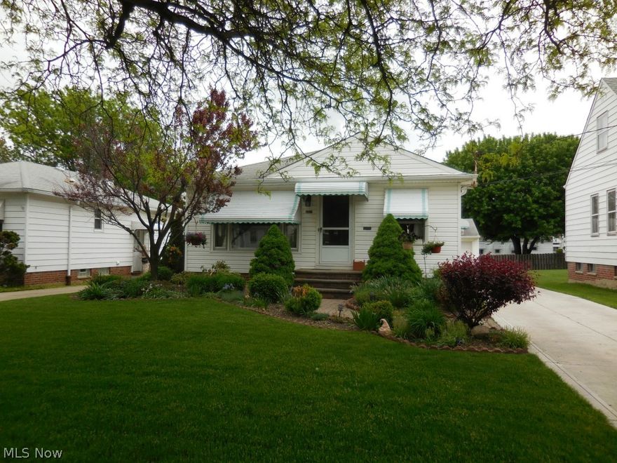 Mr. and Mrs. Clean live in this meticulously cared for 3 BR Ranch! The kitchen with laminate floors and solid surface counters has a spacious eating area and includes all appliances. There are hardwood floors throughout the living area and bedrooms, ceiling fans in every room, and a woodburning fireplace is in the living room. All rooms have been recently painted.   The bathroom has been updated and is decorated in neutral tones. The lower level includes a finished rec-room, plenty of storage and a laundry area with new laundry tub, washer, and dryer. The nicely landscaped front yard includes wired lighting while the back yard features a stone patio and in ground gas grill.  Other features of this home include newer windows, updated electric, a 2 car garage, and new driveway. This home is Garfield Hts Violation Free and Priced to Sell. Please call for an appointment today!