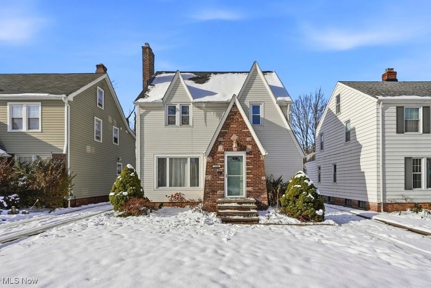 Nestled in a prime location, this inviting 1,563 square foot Colonial Tudor-style home effortlessly blends historic character with modern amenities. The home’s timeless appeal is immediately evident in its distinctive brick accent front, welcoming entry foyer, and original architectural details that capture the essence of its 1930s charm. With three bedrooms and one and a half bathrooms, the home features hardwood floors throughout the main areas, providing both warmth and durability. The bright and airy living room is a focal point, complete with a cozy wood/gas burning stone fireplace—ideal for relaxing on chilly evenings. The classical built-in shelves offer the perfect setting for displaying books and cherished décor items. The living room transitions seamlessly into a spacious dining room, creating an open environment that is perfect for entertaining guests or enjoying everyday family meals. Dedicated spaces within the home include a private office, a tranquil reading/second office/morning room, and an upstairs 3 season sunroom, providing flexibility for work, study, or relaxation. The kitchen features sturdy oak cabinets and durable ceramic tile flooring. For those seeking opportunities to customize, the third-floor unfinished attic provides potential for future expansion or additional storage solutions. The unfinished basement is a blank canvas, ready for your personal touch and finishing ideas. The two-car garage with newer siding  offers ample parking and extra storage space. The spacious fenced-in yard is an added plus.  Updates include a new roof (2023), a new furnace (2023) and a new hot-water tank (2024).  The home’s ideal location places you close to all essential amenities, including grocery stores, restaurants, shops, and hospitals, ensuring daily errands and needs are easily met. Don’t miss the opportunity to own this unique property that perfectly combines historic elegance with everyday functionality in a highly sought-after neighborhood.