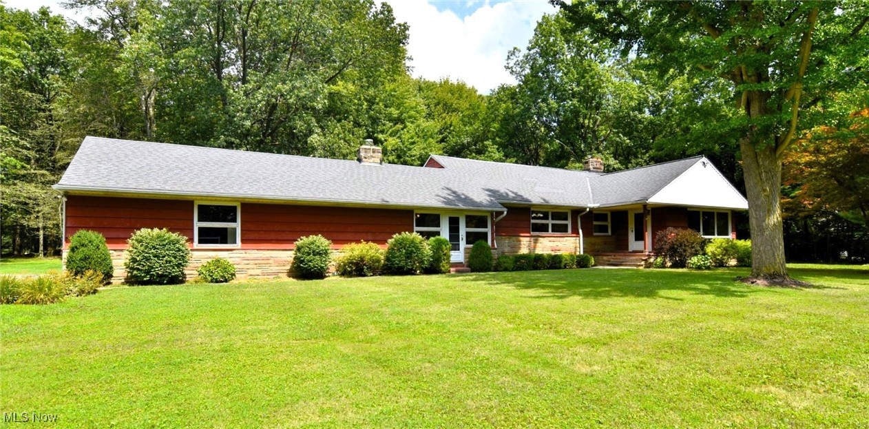 One of the most coveted neighborhoods in Orange Village with a culdesac off of a culdesac. This spacious five bedroom, two and a half bath Cape sits on almost two acres with an attached two car garage and full basement. Lovingly maintained by one owner, the living, dining and family rooms all have beautiful wormy chestnut paneling and both the living and family room have wood burning fireplaces. Three bedrooms, a full bathroom, laundry room with a large closet for plenty of storage completes the first floor. There are two bedrooms on the second floor and another full bathroom. The full lower level would be great for additional living space with three separate areas. This home is waiting for the next owner's personal touch. It has a great sunny and level yard for gardening or play equipment and lots of room for an outdoor patio space as well. This tucked away neighborhood is so close to the 422 Alt for easy access downtown or anywhere and in the award winning Orange school district!