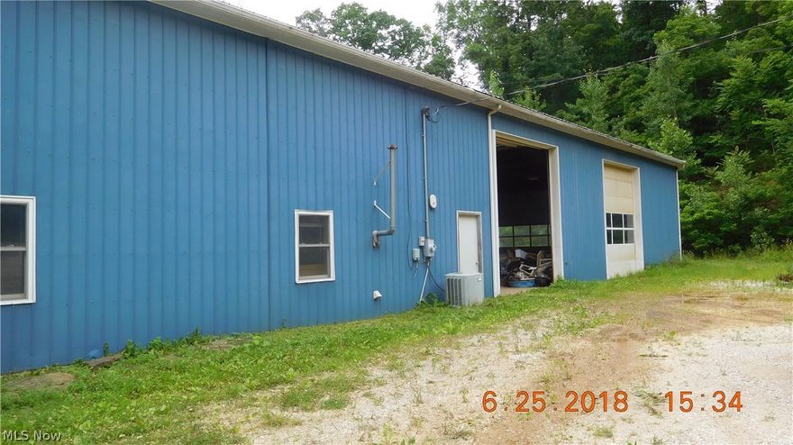 Hunter's Paradise! A total of 51.79 wooded acres for hunting and 4-wheeling and shop with living quarters. The shop measures approx. 60 x 50, has 5 huge garage doors and 20 ft. tall ceilings from floor to bottom of rafters. Land backs up to Wayne National Forest and property is extremely private. tere is road frontage, possible building sites, and trails already on the property. Mineral rights do not convey.