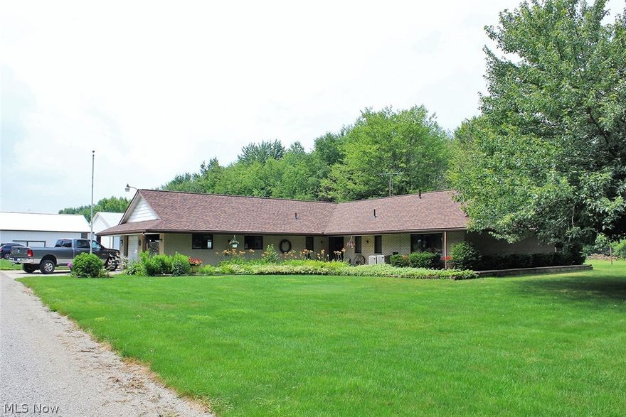 Spacious Brick Ranch home w/ 2,352 Sq ft of living features open concept kitchen with appliances, breakfast bar and dining area. Large family room with gas fireplace that leads to a private patio perfect for entertaining. Master suite, with dual closets and full bath. Two additional nicely sized bedrooms, 2 full baths & laundry. 2 car attached garage. 64x54 outbuilding with concrete floors, water, electric, workbench overhead heat & 12ft overhead door. Attached with additional 12ft overhead door is a  56x54 pole building with 15x30 storage area. Buildings adaptable for a multitude of uses. All on 6.5 acres of land with fenced pasture in the heart of New Franklin. Many updates including Roof (2017), Gas F/A Furnace (2017), Modern Laminate Flooring in Kitchen & Baths (2017) & Carpet in Family Room & Hallway (2017). Privacy & Country living close to amenities!