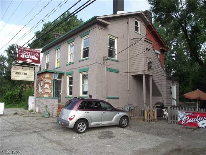 Own a piece of history! This beautiful brick almost 3000 sq ft building is complete with upstairs rentable rooms. Don't miss the great opportunity! Owner financing maybe available. Call today for private showing. 07-00-008-114-007