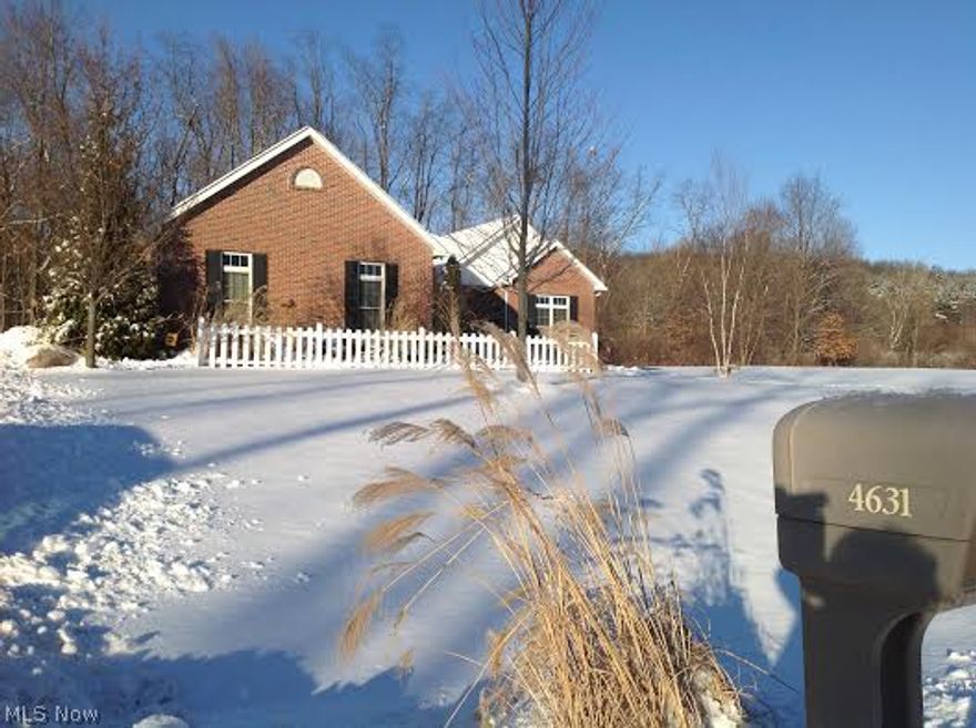 This fabulous ranch with 3990 square feet of living space has it all!  From stunning wood floors throughout main living areas of home, to 10 foot ceilings and extra tall windows, very open floor plan with formal dining area, Great Room, spacious eat-in Kitchen with extra tall cupboards, lovely counters, pantry, center island... leading to warm and inviting sunroom which is surrounded by phenomenal views of wooded area and expansive side yard with sunrises and sunsets to be remembered.  This lovely home is located 5 minutes from 21 and 77 with super easy access to Cleveland, Akron, Medina.   Location, Location, Location!  The home sits on 1 1/2 acres on a country road in the heart of Copley in area of other fine homes.  In addition to the 4 bedrooms (including first floor master with larger master bath and walk-in closet), there are 3 full baths on the first floor and 1/2 bath on the lower level.  The lower level is finished with carpeting and dark gray laminated flooring, a full wet ba
