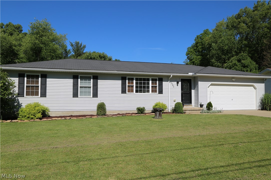 Welcome home to 1932 Stimpfel Drive, a move-in ready 3 bedroom, 1.5 bath ranch located on a beautiful private dead-end street. When you pull in, you will be greeted with a newly landscaped yard and concrete driveway. Step inside, and fall in love with natural light pouring in from a huge front window and vaulted ceilings that help create a large, airy living space. The open floor plan continues into a great dining area featuring a slider door that steps down onto a large concrete patio and gorgeous views of your large, private lot! The kitchen offers granite countertops, tile backsplash, stainless steel appliances, built in pantry and an abundance of cabinet space. Right off the 2 car attached garage is a conveniently located half bath. Great spot to wash up after yard work or for guests to use when visiting. Three bedrooms and a full bath with double sinks complete this first floor. The lower level offer so much space for an additional bedroom, fitness room, game room and more! Such a