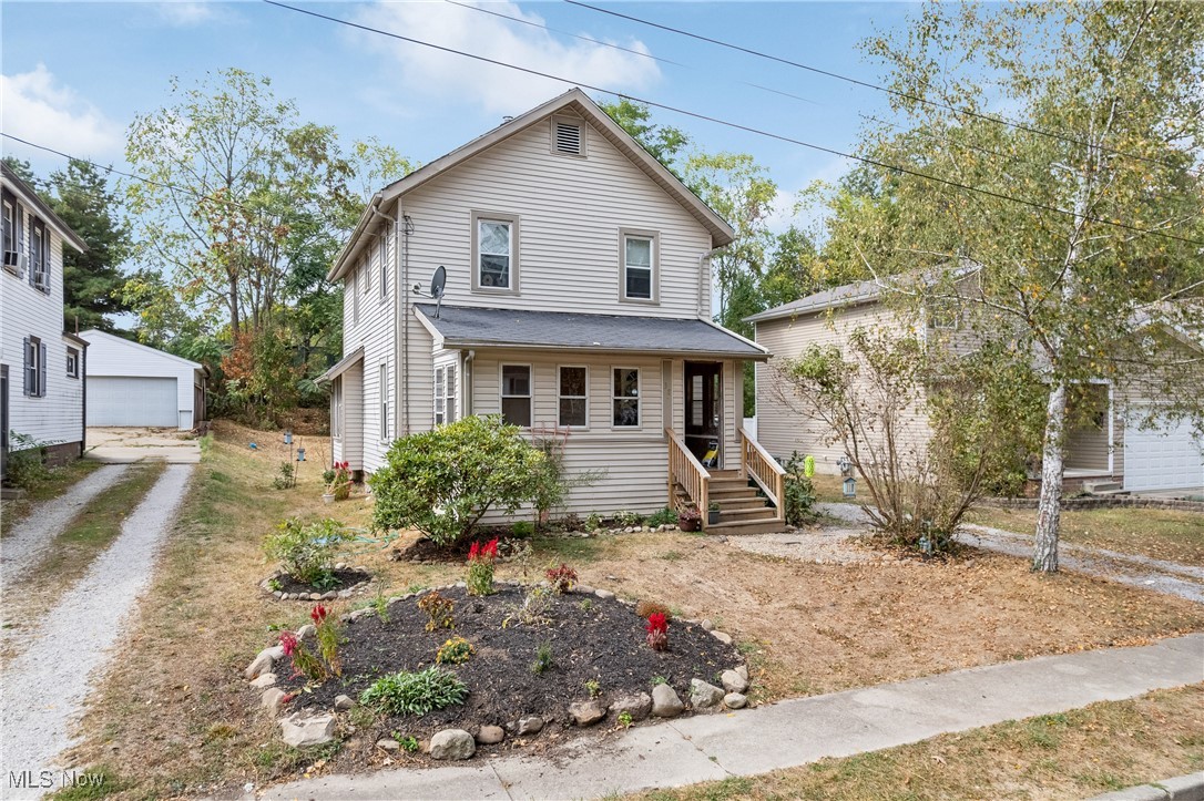 Welcome home to this beautifully updated four bed, two bath colonial in Mogadore Village!! This home is set on a quiet dead - end street with walking distance to neighborhood amenities, schools and restaurants. Leave your coat in covered porch area and step into the spacious living room with open concept dining areas. First floor living with a bedroom and bathroom on the main level. Enjoy the new carpet, flooring, lighting and upgrades throughout!! Take a break and relax on the private side deck and patio. This home is full of charm with built ins and storage at every turn. View today!!