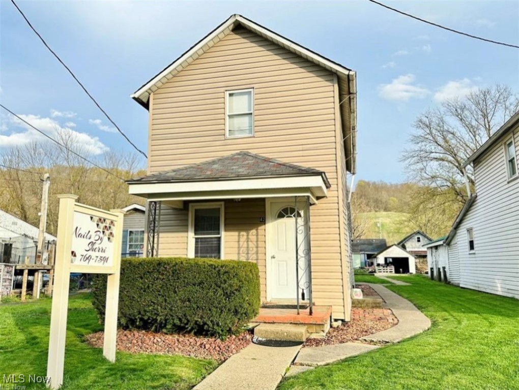 This versatile 2 bedroom, 1.5 bath home offers endless possibilities! Previously operated as a nail salon, the property features a commercial-style front area complete with a half bath and kitchenette—perfect for a home-based business or creative studio. Behind the business area on the main floor, you'll find a full kitchen, full bath, and laundry space, providing all the essentials of comfortable living. Upstairs, two spacious bedrooms. This property could easily be converted back to its original layout, making it an ideal option for homeowners, investors, or entrepreneurs. Whether you're looking to live, work, or both, this flexible space is ready for your vision! Contact your agent today to schedule a private showing.