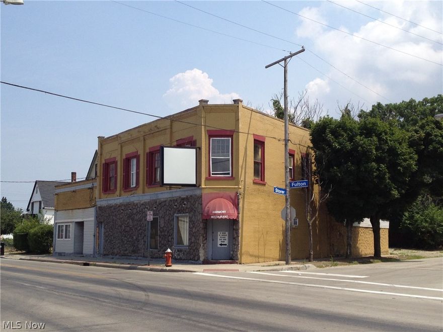 2 story block building on corner lot previously used as bar/restaurant.  First floor has bar area with own entrance, 70 person restaurant area with fireplace, kitchen area.  2  apartments on second floor with separate entrance.