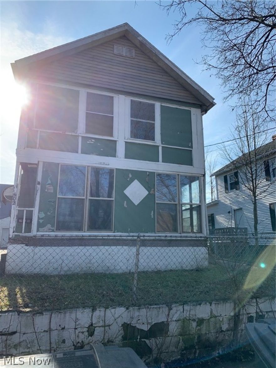 Two unit, Two Story Colonial with 2 car garage! Great for Investors, needs TLC