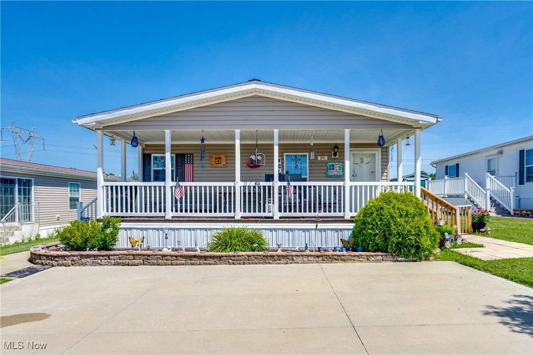 Check out this move-in-ready manufactured home in Lake Sherman Village! Nestled in the rural area of Navarre, the backyard overlooks acres of undeveloped land, making for a spectacular view. From the 8x27 front porch, enter the spacious living room, featuring newer LVP flooring, and it opens up to the kitchen. Speaking of the kitchen, you'll find beautiful laminate countertops, newer appliances, and a laundry closet. Down the hall are three bedrooms, all with newer flooring. The master suite features crown molding, and the ensuite comes with a tub/shower combo and a single vanity. The second full bath features laminate counters and another tub/shower combo. Outside, you'll find a large paved driveway that can accommodate up to three cars, a lovely front porch for enjoying your morning coffee, newer steps/pavers on opposite sides of the deck, a newer back deck with gorgeous views of land, and two sheds for any outdoor storage needs. Enjoy the community amenities including a playground, clubhouse, bus shelter, basketball court, BBQ area, and a pavilion. You don't want to miss this fantastic property; schedule your showing today!