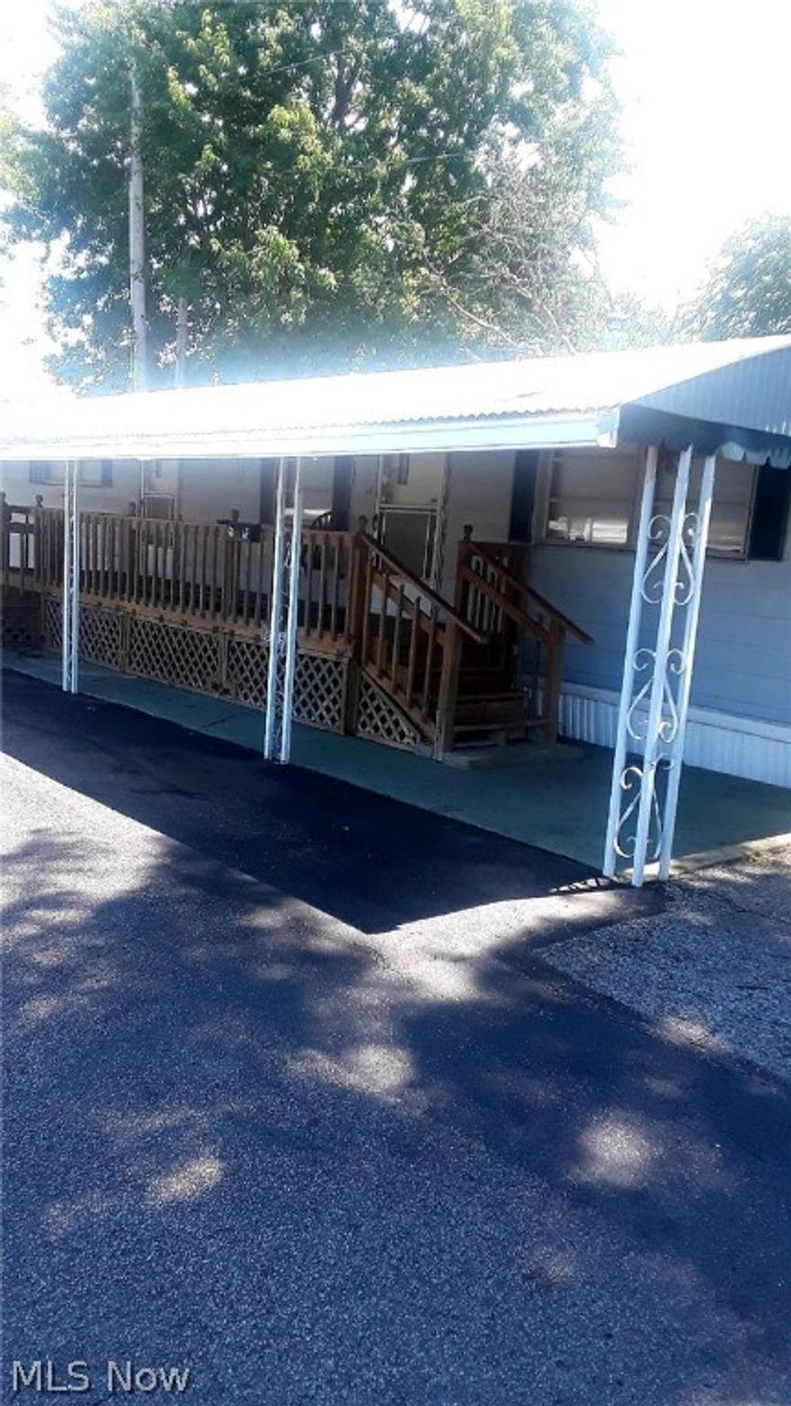 Large 2 bedrm, 1.5 bath Doublewide mobile home. Quiet lot. Very small easy to maintain lot. Bedrms have large closets & built-in drawers. This unit features a 12x14 hobby shed w/electric service.