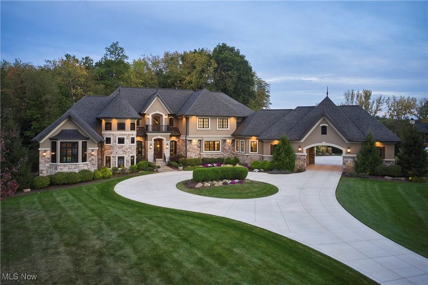 Welcome to this Luxurious home that is located in the Exclusive, Woodlands of Sharon Falls in Highland Schools. This Masterpiece boasts Custom Finishes & Elevated attention to Detail inside & also in the surrounding 2 acre Oasis with Summer Kitchen. Over 10,000 SqFt of living space, the Elegant features of this home begin w/a Barrel Vaulted Ceiling in the Grand Foyer.  As you enter the home, you are greeted w/the Great Room that has Vaulted Ceilings, Hand Scraped Beams, Built-Ins, & a Stone Surround Fireplace. The Chef's Inspired eat-in Kitchen has High-End Finishes & includes Top of the Line Built-in Appliances, including a Thermador Range/Cooktop w/a Pot Filler, an Electrolux Refrigerator, Pantry, Copper Sink, & Quartz Countertops. The Beautiful Butlers Pantry with Granite Counters, Wall Ovens & a Second Refrigerator are convenient for prepping. The Home Office is a Private & Light Filled Space just beyond the Butlers Pantry. The main living floor also has an "Entertainment Wing" that consists of a Theater Room, Bar Area, & Billiard Room. The 1st Floor Primary Suite is True Luxury as there are His & Her walk-in Closets and an En-suite Bath w/a Stunning Barrel Vaulted Ceiling with Chandeliers, Double Vanity, Makeup Vanity, & a Gorgeous Shower with a Moen Smart Shower System. All three Spacious Bedrooms on the second floor have En-suite Baths & Walk-in closets as well. The Finished Walk-Out Basement features the 5th Bedrm w/additional Egress Windows, Half bath that is Plumbed for a Full Bath, Large Light filled Exercise room, more walk-out access & so much storage space. The Screened & Terraced Patios provide Pvt Outdoor Areas for Guests. This home features a Porte-cochère that leads to a total of 5 Heated garages tall enough for your custom car lift.  Included are all kitchen appliances, washer/dryer, built-in grill, pool table, theater room screen, wine fridge/ice maker in wet bar, & all window treatments. This home is a must see & a true display of warm luxury...