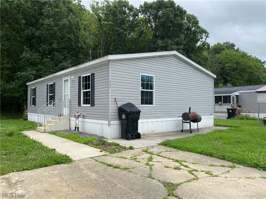 Park has a community room and playground. Buyer is responsible to make application and get approval from Jefferson Mobile Estates prior to sale.  Park fee does not include water and sewer. 2016 double-wide manufactured home with a great open floor plan. Large living room opens into an eat-in kitchen with laminate countertops. Stove and dishwasher included.  Laundry room off the kitchen.  full bath.  Large master bedroom with double closets and full master bathroom. Two additional bedrooms complete this home. Laminate floors throughout all rooms.