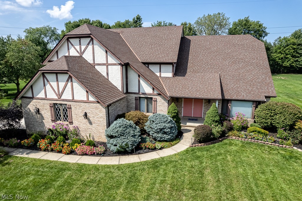 This one owner, meticulously maintained gem, tucked away in Wind Estates is truly a must see! Plenty of space, 1 acre of land, convenient to shopping and highways, and 25 minutes to downtown Cleveland! Offering 5 bedrooms (plus 1 in basement), 4-1/2 baths, finished basement with full kitchen, bedroom with a full bath, a 3 car garage and over 6400 sqf. Walk into the impressive 2 story foyer and entertain your guests in the formal living and dining room. Open concept kitchen with maple cabinets, granite counters and plenty of storage, eat in area that can hold a table for 10, adjoins the comfortable family room with gas fireplace, impeccable wood floors and ceiling with wood beams. The main floor also offers a guest room with ensuite or a master bedroom, a 20x40 all season room with a plethora of windows that overlooks the beautiful, deep back yard and a laundry room. The 3 main bedrooms on the second level are nicely sized, have ample closet space and ceiling fans and the master​​‌​​​​‌​‌​​​‌‌​​​‌‌‌​​‌​​‌‌​​​​ bedroom