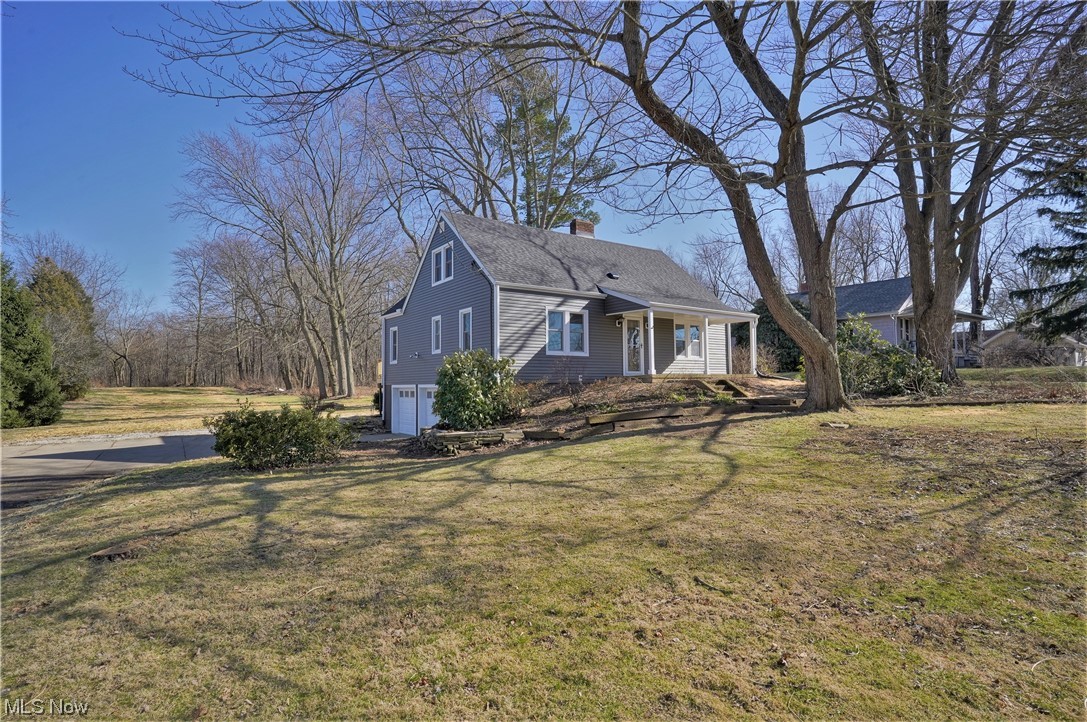 Welcome to this stunning, turn key bungalow on 4.7 acres in Green school district!! When you come inside from the darling porch you will see a lovely sitting room with an amazing word burning fireplace and beautiful original wood flooring! Off the sitting room is an open kitchen that will make you say WOW! The kitchen has brand new white shaker cabinets, granite countertops, vertical shiplap backsplash, and stainless steel appliances, including washer and dryer! Also downstairs is a family room with a sliding glass door to the new deck. The deck overlooks your huge, 4.7 acre lot! Three nicely sized bedrooms, one on the main floor and then two upstairs. Along with all the cosmetic upgrades throughout; the home also has a new roof, windows, siding, high-efficiency furnace and AC, and septic. Do not miss this house to become your forever home!