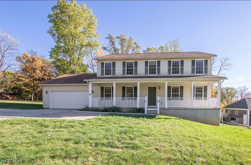 This is one of those homes that feels right the moment you pull in the driveway.  Set on a peaceful one-acre lot backing directly to Sagamore Hills Park, this custom-built 2016 home offers rare privacy, wooded views & minutes from highways, shopping, & dining. Located in the Nordonia Hills School District, it offers the best of both worlds: ample space to breathe without sacrificing convenience. The inviting front porch invites you in & sets the tone for what's inside. Step through the door, & you'll find a home designed for real life, hosting, working from home, & everyday moments. A formal dining room sits just off the entry, perfect for holidays & celebrations, while French doors open to a bright bonus room that works beautifully as a home office, playroom, or creative space.  The heart of the home is the open living room & kitchen, filled with natural light & peaceful views of the woods beyond. Cozy up by the gas fireplace or gather in the kitchen, which offers plenty of cabinetry, a large pantry, & an easy flow for entertaining. A mudroom, laundry room, & half bath are thoughtfully tucked just off the attached two-car garage. Upstairs, you'll find 3 generously sized bedrooms, including a relaxing primary suite with a walk-in closet & spa-like ensuite featuring a soaking tub, walk-in shower, & double vanity. The additional bedrooms offer great closet space, & the 2nd full bath also includes a double vanity.  Downstairs, the unfinished basement with high ceilings is a blank canvas ready for whatever you dream up. Step outside from the kitchen's eat-in area onto the composite deck & take in the serene wooded backdrop. Whether it's morning coffee or evening dinners, this outdoor space feels like a private retreat.  Homes like this don't come around often, custom-built, less than 10 years old, sitting on a full acre, and backing to parkland. If you've been waiting for a place that feels peaceful, private, and truly special? This might just be the one.