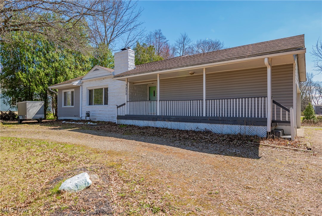 Welcome to this charming 3-bedroom, 2-bathroom ranch offering the convenience of first-floor living. Step into the spacious living room featuring a cozy fireplace and beautiful hardwood floors that flow seamlessly into the dining room. The dining room boasts sliding glass doors leading out to the deck, where you can relax and enjoy views of the expansive backyard. The kitchen is complete with stainless steel appliances. Just off the kitchen, you'll find a convenient mudroom with access from both the garage and the covered porch. Two generously-sized bedrooms and a full bathroom are located on the main level. The lower level offers a private retreat with a third bedroom, complete with an attached full bathroom. You will also find a laundry room and ample storage space for all your needs. Set on over half an acre, the backyard provides a peaceful and private space, ideal for gardening, outdoor activities, or entertaining guests. Recent updates include a beautifully renovated lower-level bathroom and a new well pump in 2024. Located just minutes from local shops and restaurants, this home offers the perfect blend of comfort, convenience, and privacy. Don't miss the opportunity to make it yours!