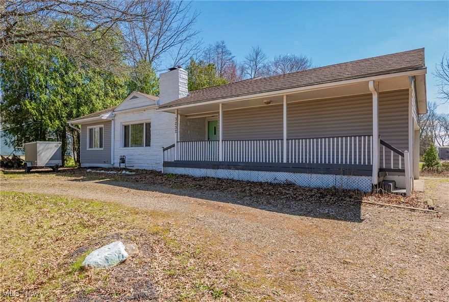 Welcome to this charming 3-bedroom, 2-bathroom ranch offering the convenience of first-floor living. Step into the spacious living room featuring a cozy fireplace and beautiful hardwood floors that flow seamlessly into the dining room. The dining room boasts sliding glass doors leading out to the deck, where you can relax and enjoy views of the expansive backyard. The kitchen is complete with stainless steel appliances. Just off the kitchen, you'll find a convenient mudroom with access from both the garage and the covered porch. Two generously-sized bedrooms and a full bathroom are located on the main level. The lower level offers a private retreat with a third bedroom, complete with an attached full bathroom. You will also find a laundry room and ample storage space for all your needs. Set on over half an acre, the backyard provides a peaceful and private space, ideal for gardening, outdoor activities, or entertaining guests. Recent updates include a beautifully renovated lower-level bathroom and a new well pump in 2024. Located just minutes from local shops and restaurants, this home offers the perfect blend of comfort, convenience, and privacy. Don't miss the opportunity to make it yours!