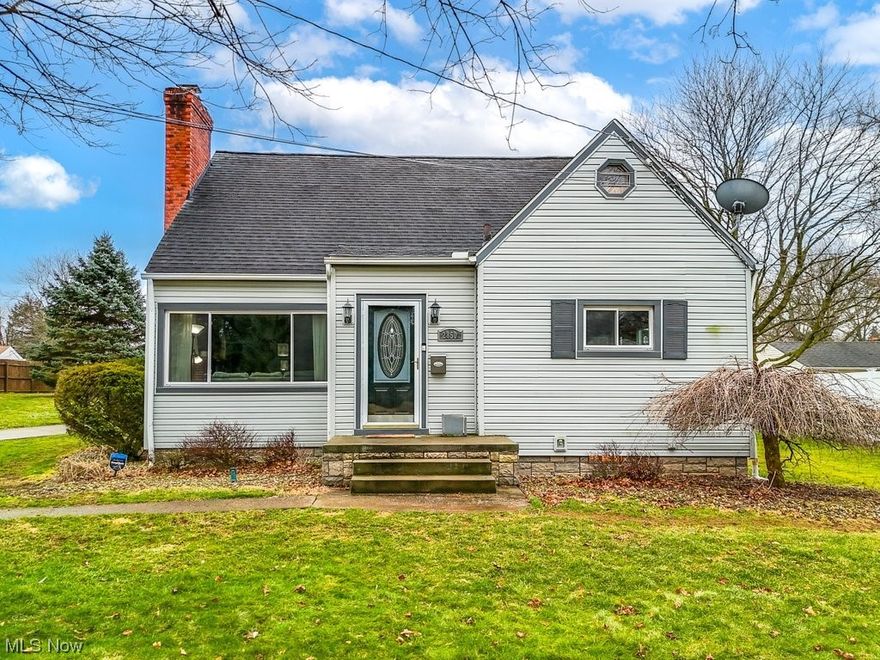 Discover the charm of this well-maintained Cape Cod home in the desirable Ellet neighborhood complete with 4 bedrooms, 1.5 bathrooms, and a wealth of thoughtful updates. Step into the inviting living room with a large picture window and a cozy brick fireplace. The large eat-in kitchen features ceramic floors and essential Stainless-Steel appliances that stay with the home, as well as convenient access to the 2-car detached garage and double-lot parcel – both rare finds in this area! Enjoy versatile living with two bedrooms on the first floor and two additional large bedrooms upstairs, one including a walk-in closet built by the owner! All living spaces are believed to have original hardwood flooring - a special treat! Outside, the spacious backyard with privacy fencing provides a serene outdoor oasis, complete with a spacious covered patio perfect for outdoor relaxation, a long wrap-around driveway to accommodate many cars when entertaining, and an invisible fence for pets. Recent renovations include newer vinyl siding, vinyl replacement windows, roof on house and garage (15 years), glass block basement windows, completely remodeled main bathroom, newer plumbing, and insulation in the attic for added efficiency. As a bonus, the W/D and basement freezer will stay with the house! A One-year Home Warranty and SimpliSafe Security System also stay with the house for additional peace of mind! With its convenient location near I-76 and the affordability and walkability of Ellet, this home is sure to please. Don't miss the opportunity to call this lovingly updated home your own!  *Please allow 24 hours notice for showings on weekdays*