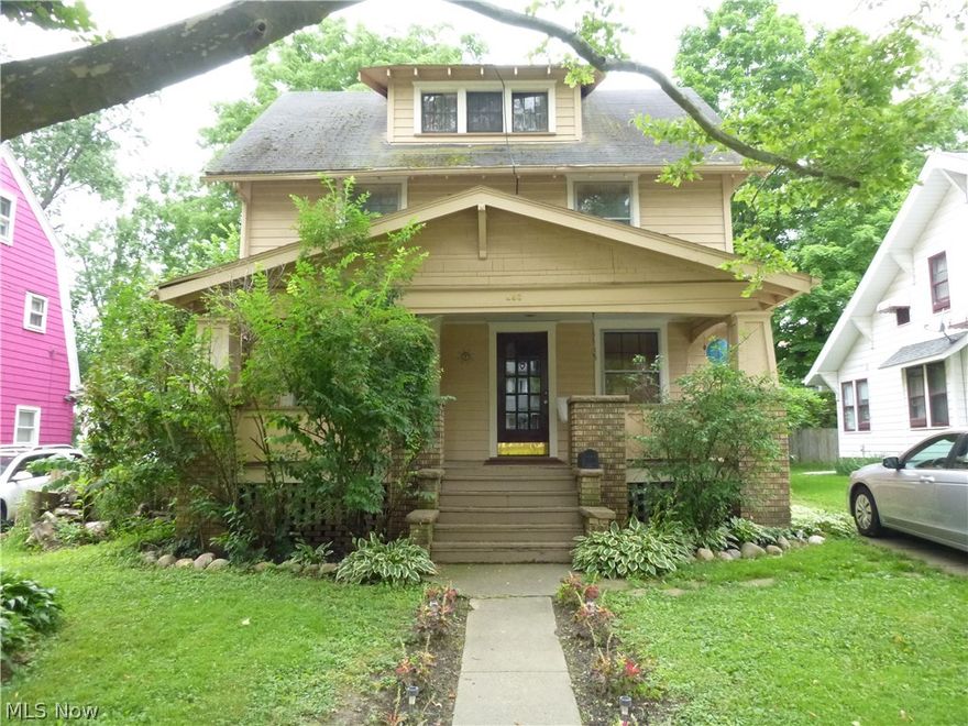 Charming 1920's Arts & Crafts Mission style home.  This lovely West Akron home features beautiful woodwork and hardwood floors throughout.  The living room has a  fabulous fireplace flanked by built in leaded glass cabinetry.  A beautiful wooden arch connects the living and dining room which boasts more leaded glass cabinetry.  A large finished attic could serve as another bedroom, office, or storage.  Furnace was updated in 2010.  Large front porch and fenced in back yard.  Don't miss this opportunity to own your dream home!
