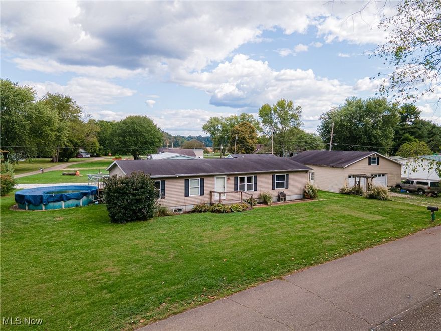 3 bedroom, 2 bathroom ranch home just outside of town!  Enjoy peaceful views of the river in the spacious ranch home. You will love the layout with living, dining, family room, kitchen, laundry, all beds and baths on the main level.  The full basement features extra-high ceilings and a dry, open layout giving you endless potential to create additional living space, a recreation area, or a workshop, whatever fits your lifestyle best! Outside, your 30X40 detached garage awaits your toys, vehicles, workshop and storage. The large deck and above ground pool makes summer days feel like a getaway right at home!