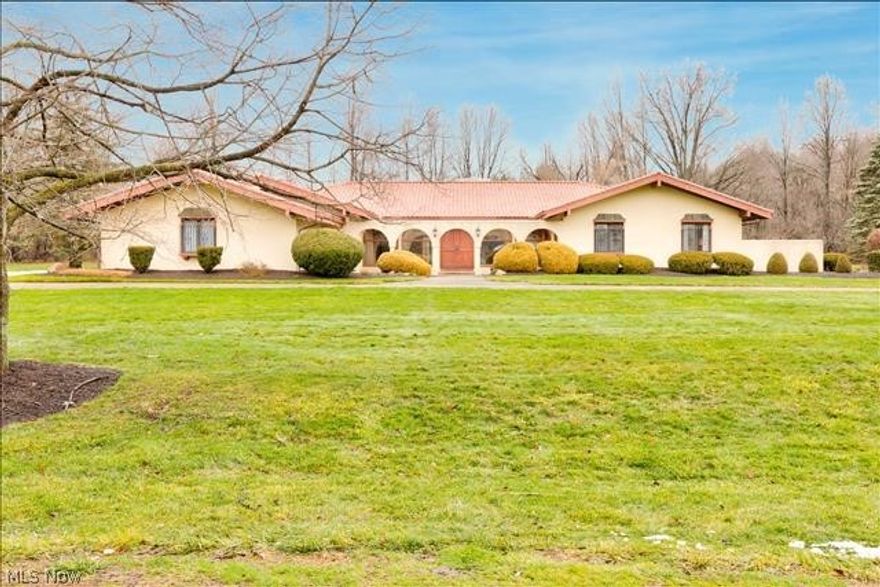 This lovely Spanish Mission Style home was specially built by the owner.   Flowing with character and charm, this spacious home features arched entryways and windows, terracotta tile roof, beautiful hard wood floors, huge solid wood doors through out, vaulted wood plank ceilings, and more architectural detail than one can imagine.  Featuring 2 large brick fireplaces, a catwalk hallway that circles the great room that sits in the middle of the home. This home boosts entertaining! The family room features a wood burning fireplace and beautifully crafted grand wet bar w ample seating. The master suite sets in back corner of home, great for privacy. The on suite offers his and her sinks and water closets. As well as a roomy, sunken jetted tub and separate shower.  Upon entering the sunroom room through  French doors, you will enjoy a plethora of natural light as well as a the view of the  inground pool, that is enclosed  for privacy with landscape of pines and flowers.   This home offers so much opportunity, setting on 3.98 acres at the end of dead end street, it is definitely a must see.  Keep it in it's original character or make your changes, the options are endless., with some TLC and updates. 3 furnaces / 3 AC/ Gas line runs to home