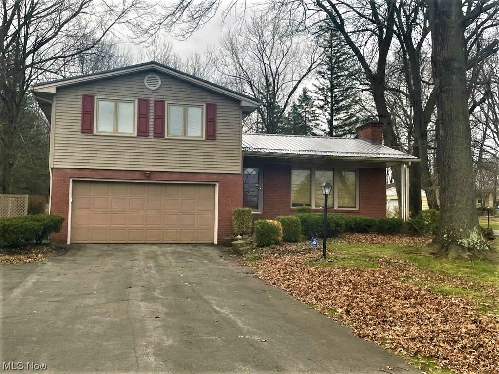 Brand New Metal Roof! Don't Miss Out on this Lovely Brick 4 Level Split Home on .75 Acre! The Main Level features the Eat-in Kitchen, Dining room, and Living room with Fireplace The Large Family room addition has a Gas Fireplace that leads out to a Brick Patio and a Large Private Backyard with a Shed. Upstairs you will find 3 nice sized Bedrooms and updated Bath. Most floors are Hardwood, The Basement level has 2nd Bath and Laundry area. This is a Well Cared for One Owner Home!