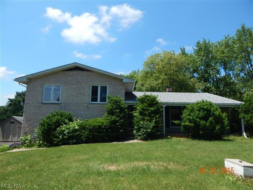 All brick split level on almost a half acre, foyer entry, living and dining open up into kitchen, lower level family room with fireplace and slider to rear patio, 3 bedrooms upstairs including a master bedroom with master bath, 2 car attached garage and 1/2 acre lot.  Equal Housing Opportunity.  Sells As Is.