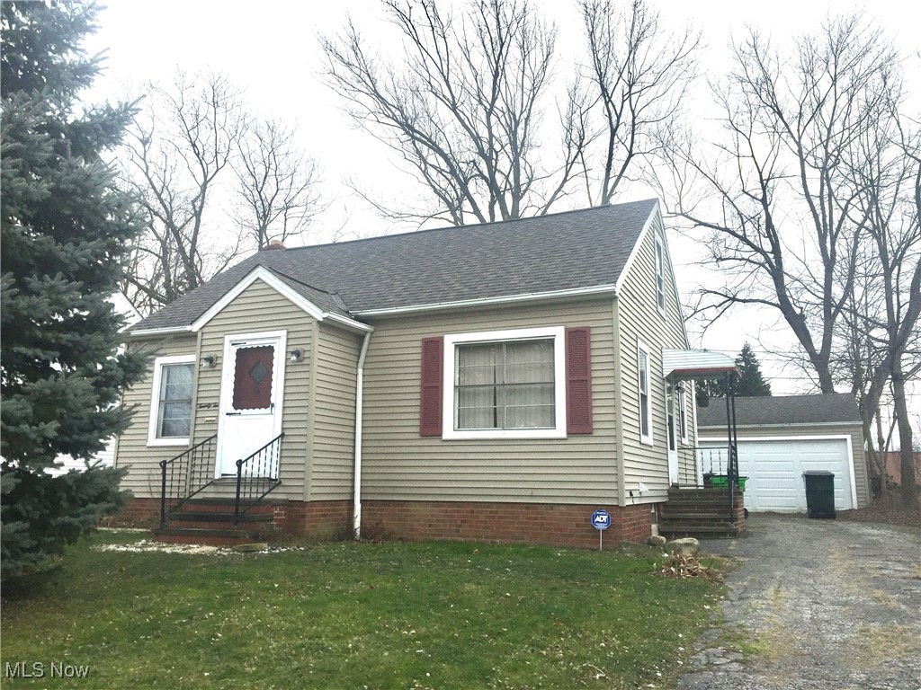 Lots of opportunity here! 3 bed, 1.5 bath bungalow plus a full bath in the basement, hardwood floors, wood burning fireplace in living room. Basement previously waterproofed. Roof on house and garage approximately 2008. Newer siding on house and garage. Newer back deck. Some newer windows. 2 car detached garage, large yard.
