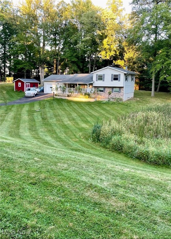 Are you looking for Green local schools, in a quiet neighborhood, situated on over an acre with all the updates? This beautiful split level has been completely renovated, with a brand-new kitchen and updated bathrooms. The whole house has been painted and lvt and bamboo flooring is throughout. The house parcel is 1 of the 3 parcels included in the sale. The 3 parcels total 1.3 acres. Updates include: *new light fixtures and recessed lighting throughout the house * New kitchen cabinets with granite countertops complete with a large single undermount sink. Stove, dishwasher and fridge stay with the home. * Both the full bath and half bath were redone in 2020. Tiled shower. *Roof: 2012 *Furnace/ AC: 2014 *Fireplace: wood burning with blowers install in 2023 *Windows: 2011 *Siding: 2012 *Sump/Lift Pump: rebuilt in 2022 *Driveway: sealed in 2023 * Shed with electric: 2008 Taxes approximately (2024) $4476