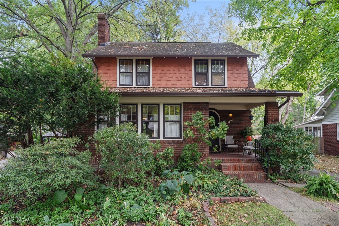 Welcome to 557 Letchworth Dr, Akron – A Classic Colonial in the Heart of Merriman Hills! This timeless 3-bedroom, 2.5-bath home blends warmth, charm, and modern comfort in one of Akron’s most desirable neighborhoods. Step onto the welcoming front porch—perfect for morning coffee or relaxing in the evening—and through the beautiful arched wood door into a spacious living room filled with character. You’ll love the brick fireplace, original wood-trimmed windows, and charming sunroom, ideal for quiet reading or conversation. The open layout flows seamlessly into the formal dining room, highlighted by a built-in wood cabinet with glass doors that adds both style and storage. A comfortable area toward the back could serve perfectly as an office, while the inviting eat-in kitchen offers plenty of natural light and direct access to the backyard. Upstairs, you’ll find three generous bedrooms and a full bath—each filled with charm and comfortable space for the whole family. The attic provides additional storage options. The partially finished basement expands your living space with a recreation area, laundry space, another full bath, and a bonus room—perfect for guests, hobbies, or a home gym. Outside, enjoy a peaceful yard with a deck for gatherings, a handy storage shed, and a detached 2-car garage. This beautiful Colonial offers the perfect balance of character and functionality—don’t miss your chance to make it home!