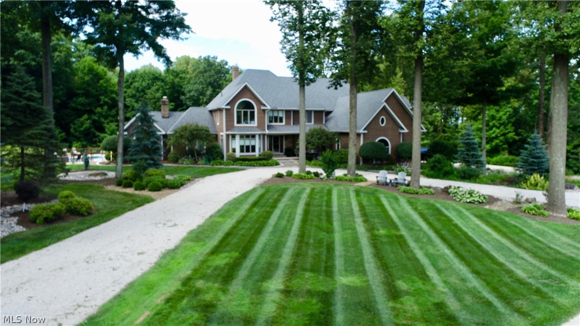 This beautiful one of a kind home is truly its own resort. 5000+ square feet above grade and another 2000+ below with 12 acres surrounding you. You're nestled backoff the road and tied in with nature and privacy yet still with easy access to highways and shopping. Only about 30 minutes from either Cleveland Hopkins airport or Akron Canton airport. This is a 5 bedroom,7 bath, 4 fireplace home with a walk-out finished basement. There are 2 master suites with one on the main level and another one the 2nd floor. Bedroom number 3 includes its very own en-suite while 4 and 5 share a Jack and Jill style full bathroom. There is more than enough room if you want to entertain. Choose your spot to relax; by the pool, on the deck, the patio, the porch, the barn/workshop, or even time in the woods. Beautifully landscaped and maintained property all around with large Tulip trees adorning the front of the home. New roof (2022), Stainless Steel Leaf Guards(2022). Ask for a complete list of updates done to this home.
Do not pull in to driveway without a scheduled appointment. House cannot be seen from the road.