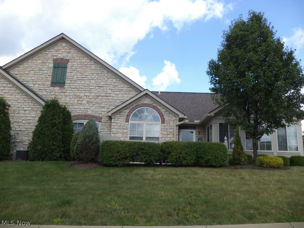 Simplify your life and move into this spacious 2/3 bedroom condo in the Springfield Ridge Community. This open floor plan includes cathedral ceilings, great room w/gas fireplace, gourmet kitchen w/stainless appliances, a breakfast bar, 4 seasons room, 2 full baths, 2-car attached garage and master suite with walk-in closet & master bath. Club house, heated pool, exercise room and more! Call for private viewing.