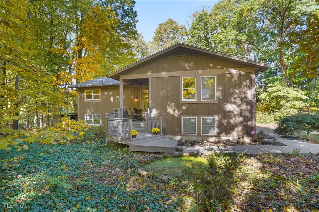 This home is nestled in the woods, offering a serene and private setting surrounded by nature. As you approach, you're greeted by a rustic exterior that blends charm with Mudd Brook creek running behind the property, adding to its tranquility. It is so peaceful listening to the running water in the creek in the ravine. Inside, the great room is the heart of the home. It features a large wood-burning fireplace made of stone with a rustic mantel perfect for cozy evenings. A beautiful array of windows overlook the woods, allowing for an abundance of light and and offering stunning views of the surrounding greenery and wildlife. The eat-in kitchen features a breakfast bar and two eating spaces so there's plenty of room for gatherings and entertaining. The primary bedroom offers three closets and full updated bath with double vanity and walk in shower. The other two bedrooms have ample closet space and the second full bath has also been updated. The lower level offers a bedroom, which could also be used as an office, with a living area/recreation room with access to the screened in porch. Roof and 2 full baths updated - 2021. Home Warranty is being provided by the seller. Gas mineral rights do convey with the property. Hot water tank - 2024 with 6 year warranty provided.