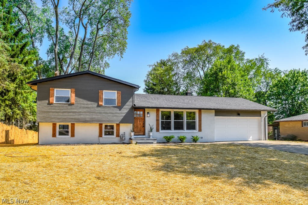 Breathtaking 3 bedroom 4-level split with a wonderful open concept in Plain LSD! Truly move-in ready with all new major mechanicals and appliances! The main level is bright, open and welcoming. Stunning shiplap walls around the brand new kitchen with open shelving, stainless steel appliances, new cabinets and a center island with seating and pendant lighting! Your inner chef will delight! Enjoy family meals in the dining room with large windows and beautiful hardwood floors. Sliding doors open to the back deck, convenient for grilling and entertaining! Cable railing on the staircase to the lower level for a sleek look. Gather in the gorgeous family room boasting a modern fireplace and sliding doors to the paver patio. A sliding barn door opens to a bonus room, great for an office. Upstairs, there are 3 bedrooms and a full bath with tile shower surround, a deep linen built-in and a new vanity with a vessel sink and waterfall faucet set against a shiplap wall. Unfinished basement for sto