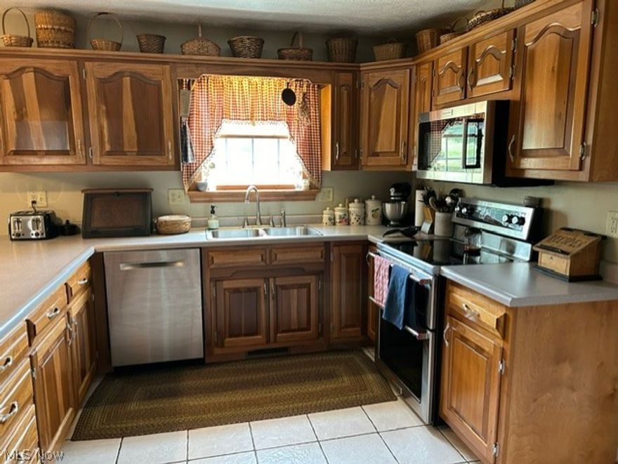 Well maintained Colonial built in 2002.  4 Bedrooms and 2.5 bathroom.  This beautiful home has everything you need from 4 Bedrooms to finished basement area.  Large yard with a wood deck, Screened in porch and covered patio.  Located outside of town but close to Cambridge and New Concord.  Easy access to Interstate 70.