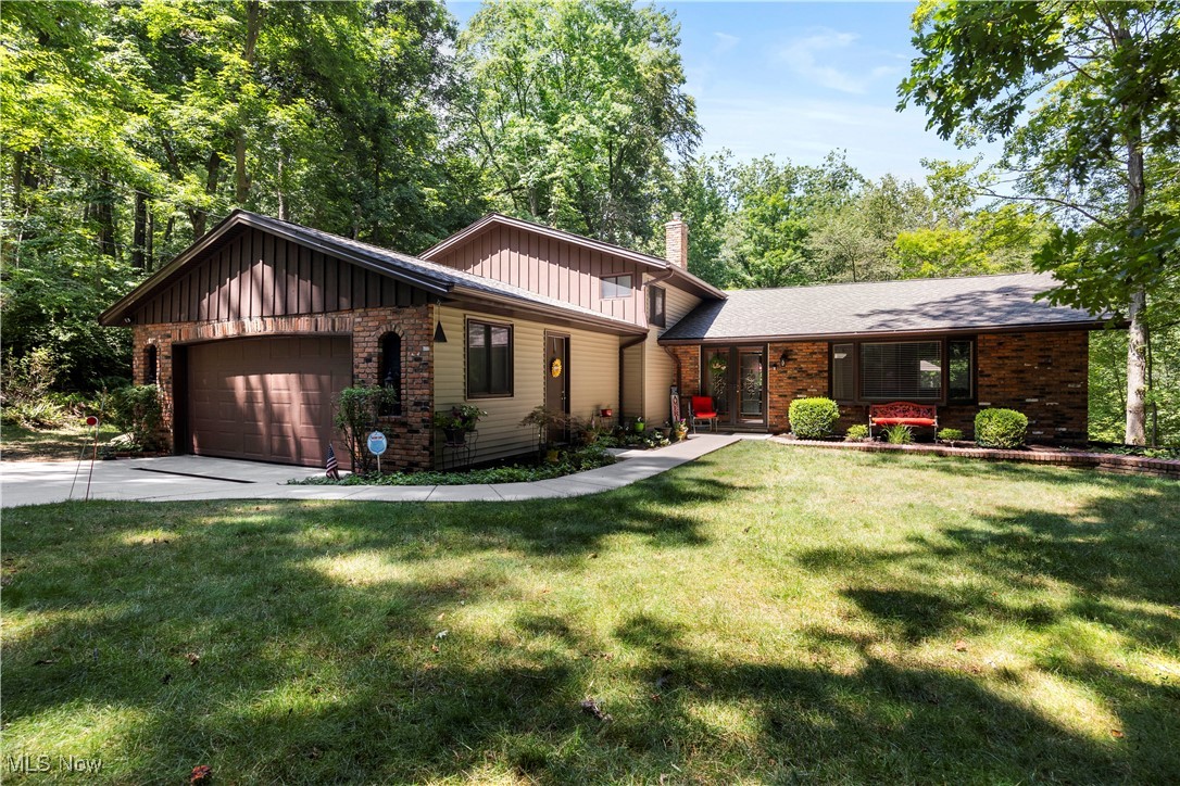 Are you searching for the perfect place to call home in Brecksville? Look no further! This stunning split-level home offers a private, wooded, park-like property spanning over 1.5 acres, complete with a serene creek. As you step inside, a welcoming foyer with a curved staircase leads you into an open floor plan featuring 3 bedrooms, 2.5 baths, and over 2600 square feet of impressive living space. The formal living and dining rooms are spacious & boast vaulted ceilings. The beautifully updated eat-in kitchen is equipped with granite countertops, ample cupboard space, and all appliances. Enjoy the amazing deck space off the kitchen's dining area, which overlooks your yard surrounded by trees and the creek, perfect for relaxing or entertaining. A few steps down, you'll find a spacious family room with a gas fireplace and a slider opening to a patio with a hot tub. This level also includes a laundry/utility room and a den or possible guest room with an adjacent half bath. The second floor features a massive owner's suite with a full bath, a double sink vanity area, a walk-in closet, and a cedar secondary closet. Additionally, there are two more bedrooms and another full bath. The home also includes a 2-car attached garage. This home has numerous improvements, including a new roof, siding, & gutters in 2018, A/C in 2021, many new windows in 2023, blown-in insulation in 2022, and deck recently Rhino Shield in 2025, along with a newer driveway, patio pad, & hot tub. Pet-free & smoke-free home, truly beaming with pride and love of ownership. Enjoy Brecksville's award-winning schools, city recreation center, library, shopping, and fine dining. Conveniently located near Metro Parks, with quick access to I-77, I-80, and I-271, and close to Brecksville/Broadview Heights Schools. Come & see for yourself and fall in love!