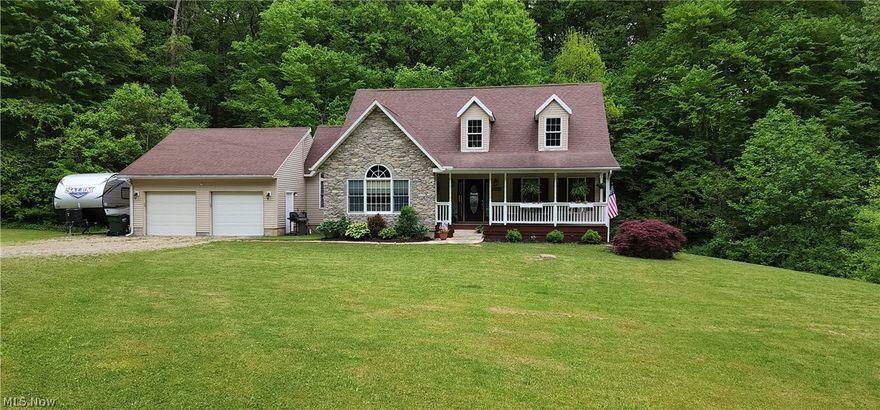 Beautiful One And A Half Story Warm and Inviting Home Nestled up Against the Woods  Finished in Warm Solid Wood Doors and Trim situated on 1.64 Acres on a Cul-De-Sac In the Tri-Valley School Containing Great Room with Vaulted Ceiling, with Tremendous Stone Gas Fireplace, 2 Dormers and a Overlook Balcony, 3 Bedrooms (Master is main Floor) & Features Large Arched Window, Super Sized L-Shaped Master Bath with Double Sinks, Walk in Closet, Jacuzzi Tub & Large Ceramic Tile Shower, In Addition the Main Floor Contains a Laundry Mud Room, 1/2 Bath, Screened in Rear Porch Overlooking the Woods Behind, Walk-in Pantry, Beautiful Breakfast Nook, Kitchen with Stainless Steel Appliances ( Kitchen & Breakfast Nook Have Attractive Tin Ceilings with the Kitchen also having a Tin Backsplash, The Formal Dining Room Finishes the Main Floor, A Beautiful Oak Stair Way Leads You to the Overlook Balcony With Access to the Knotty Pine Bedroom containing a Huge Walk in Closet, Full Bath & 3rd Bedroom, The Lower