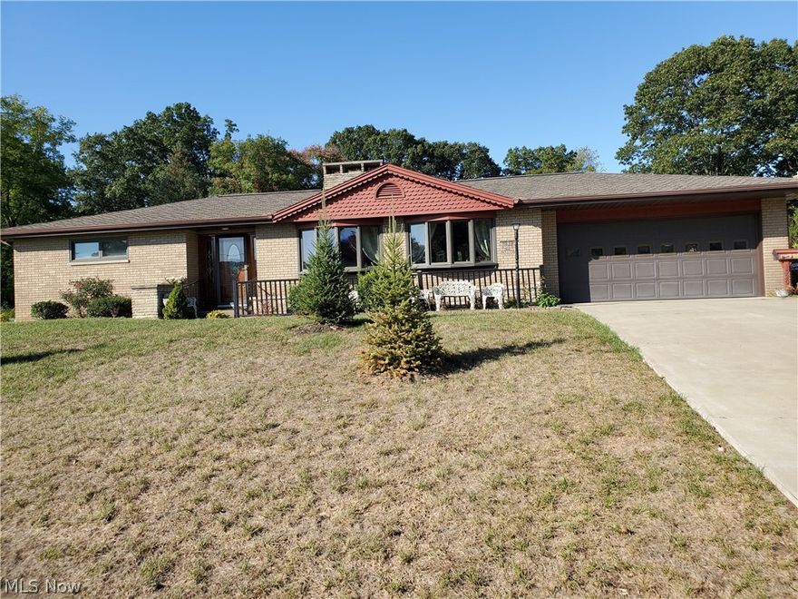 Brick ranch on nice corner lot with 2 car garage and a 10x25 covered porch.