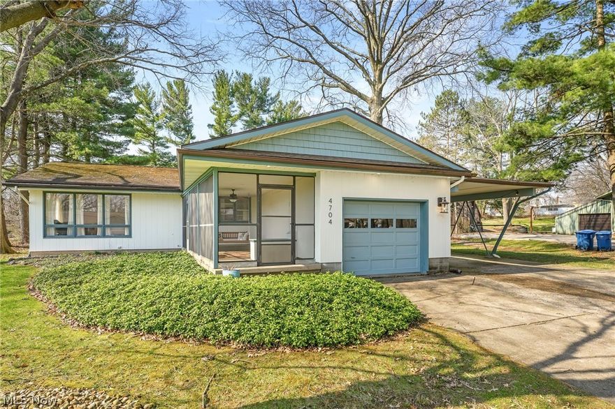 Welcome to 4704 Garrett Drive....located in the Norton City School District. From the moment you pull in the drive you will fall in love with the curb appeal and the mid century modern feel of this home. A screened porch welcomes you and gives you added outdoor living space as well as a carport and patio. The spacious living room features unique tile flooring and floor to ceiling windows allowing natural light to fill the room. The well planned kitchen offers ample storage and counter space as well as a breakfast bar and eating area. Just off the kitchen you will find a half bath and access to the garage and carport leading to the patio and level backyard. All three bedrooms boast hardwood floors and large closets. The bedrooms share an updated bath and there is a possibility for a half bath or first floor laundry in the master bedroom. In the lower level you will find the utility room which houses the laundry area with a shower. Two additional rooms have endless possibilities just waiting for you to make it your own. The exterior is painted cedar and the roof, furnace and C/A have been updated. Don't miss the opportunity to own this unique property. Call your favorite agent today to schedule a private showing!