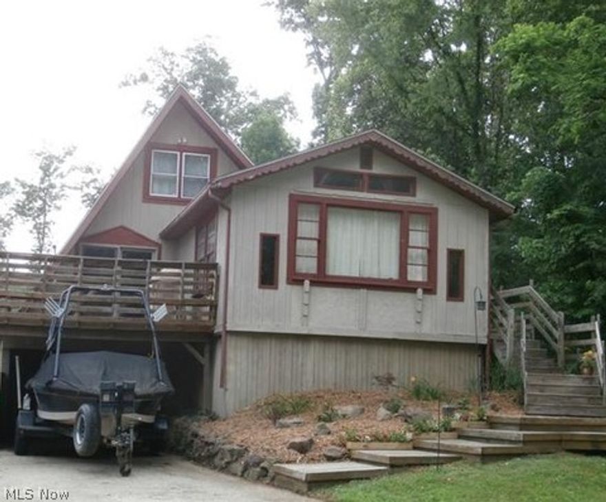 Nice lake home on level lot. Convenient location to lake and docking area. Home has been updated-includes bath, kitchen and flooring. Enjoy summer nights in the screened porch or entertain on the large, private rear deck. Sliding glass door from dining are leads to front deck. Decorative fireplace heater adds warmth and charm to living room.  This home is perfect for year round or can be used as second home get away to the lake.